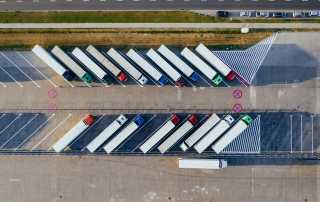 Freight Transportation Companies - Glendale, California | MoveFreight, Inc. air view of trucks parked for shipping - Freight Transport Quotes